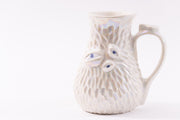 White mother of Pearl Mug with eyeballs